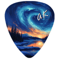 A guitar pick featuring a detailed fantasy landscape illustration with a swirling blue and teal starry sky, snowy mountains, pine trees, and an orange sunset reflected in a river. A stylized white 'ak' signature is printed in the upper right.