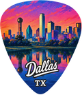A guitar pick shaped like the Dallas skyline at sunset, with a colorful cityscape over water and the words 'Dallas TX' printed near the bottom.