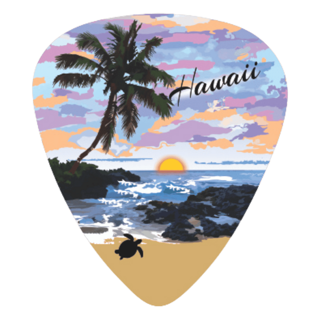 A guitar-pick-shaped sticker or patch featuring a Hawaii beach sunset scene with a palm tree, ocean waves, rocky shore, sandy beach, and the word "Hawaii" in script.