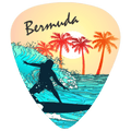 A guitar-pick-shaped graphic with the word "Bermuda" at the top, showing a stylized beach scene with palm trees, a sunset, ocean waves, and a surfer silhouette.