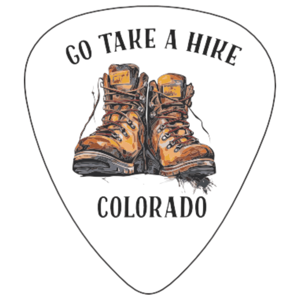 A white guitar-pick-shaped graphic with the words “GO TAKE A HIRE” at the top and “COLORADO” at the bottom, centered around an illustration of a pair of brown hiking boots. The design appears to be the product artwork itself rather than a lifestyle scene or auxiliary chart.