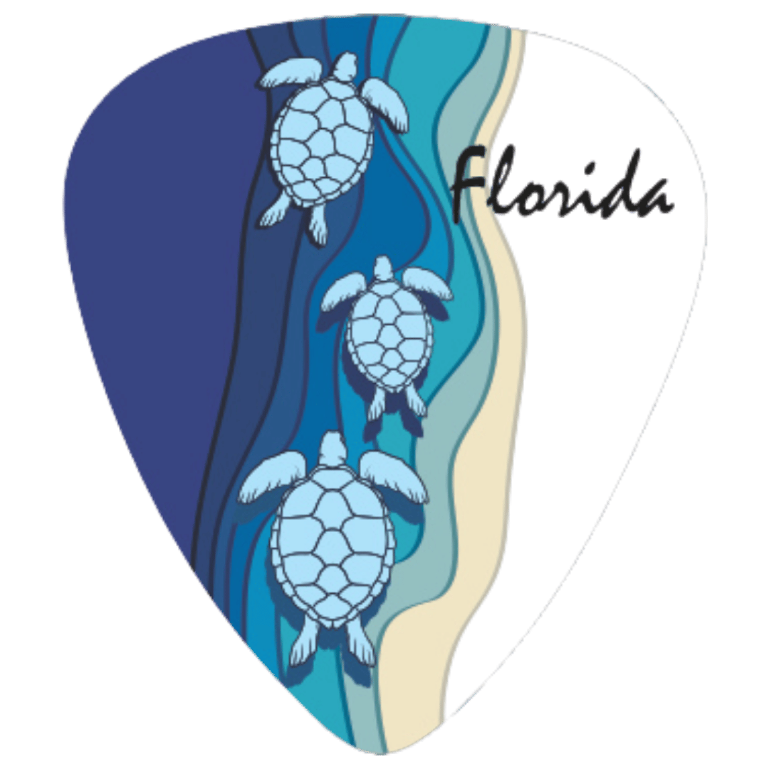 A guitar pick-shaped graphic featuring three illustrated sea turtles swimming in layered blue water, with a sandy beige shoreline and the word 'Florida' in black script on a white background.