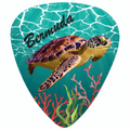 A guitar-style pick shaped graphic featuring a sea turtle swimming underwater on a turquoise ocean background, with coral reef details and the word "Bermuda" in black script near the top.