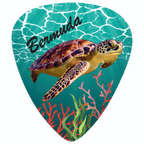 A guitar-style pick shaped graphic featuring a sea turtle swimming underwater on a turquoise ocean background, with coral reef details and the word "Bermuda" in black script near the top.