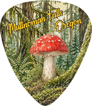 A guitar pick shaped like a forest scene with a large red-and-white mushroom in the center, green foliage, and yellow text reading 'Multnomah Falls Oregon' across the top.